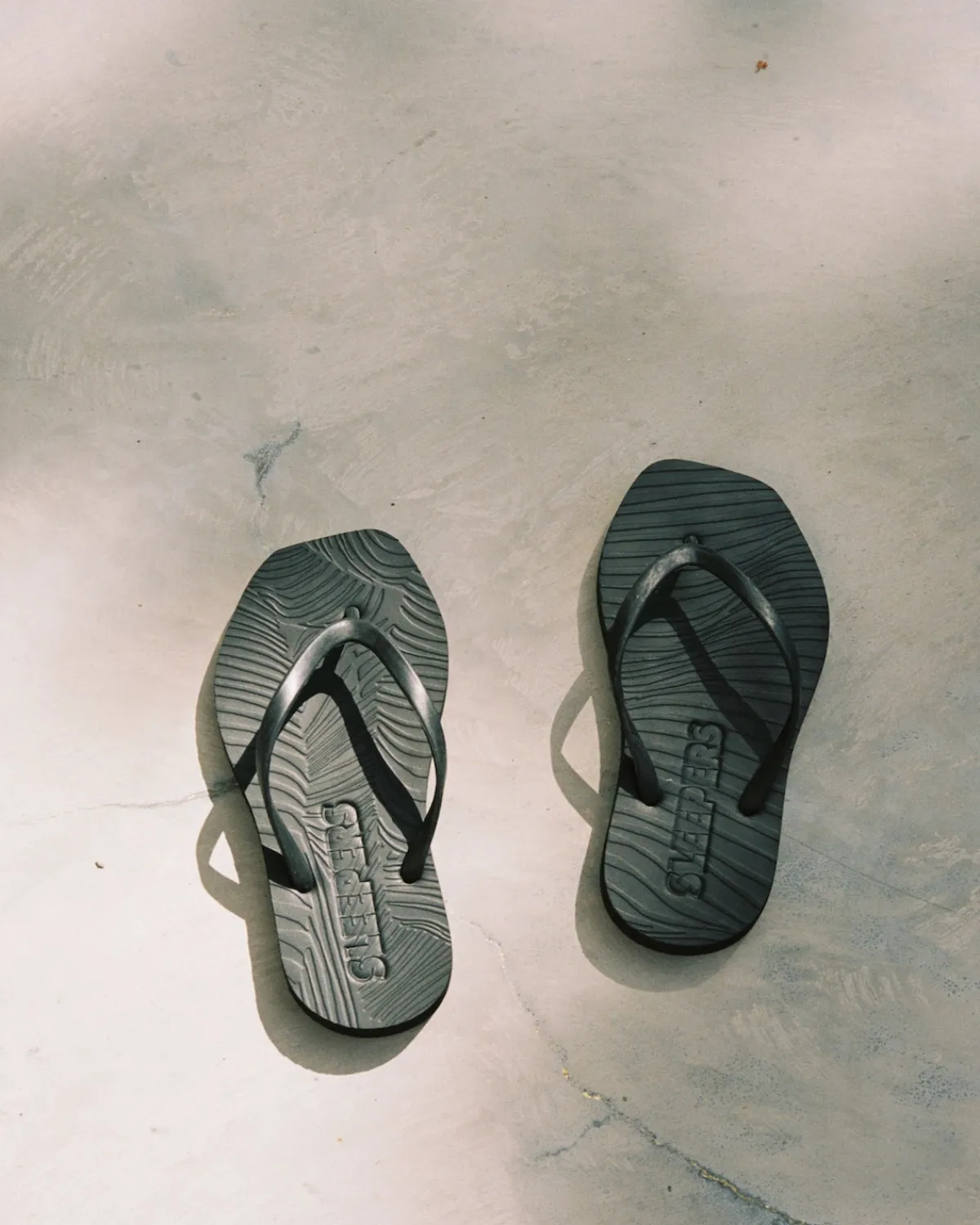 Shop JAN 'N JUNE SLEEPERS TAPERED FLIP FLOPS BLACK